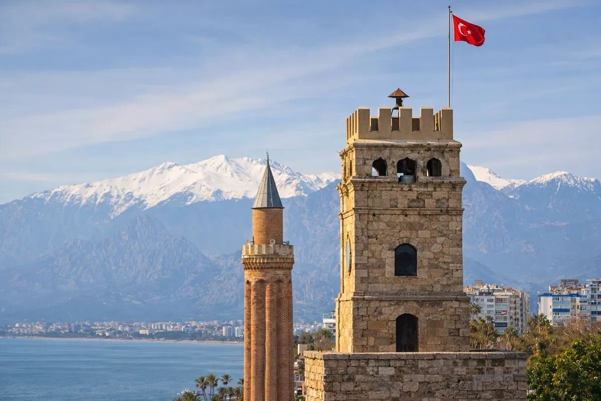 The Yivli Minare (Fluted Minaret), a landmark of Antalya, with the Taurus Mountains behind