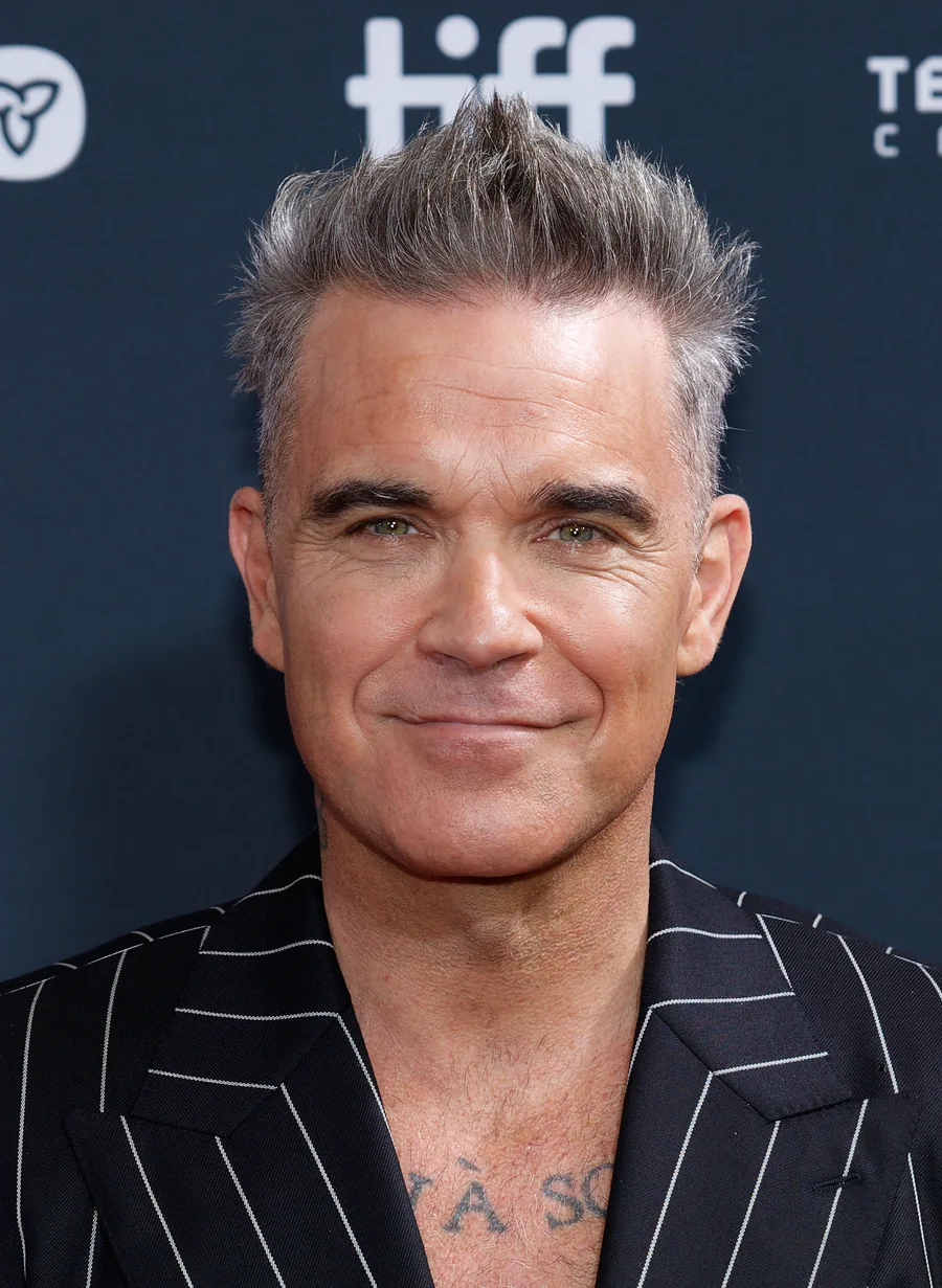 Robbie Williams smiling at the Toronto International Film Festival in 2024